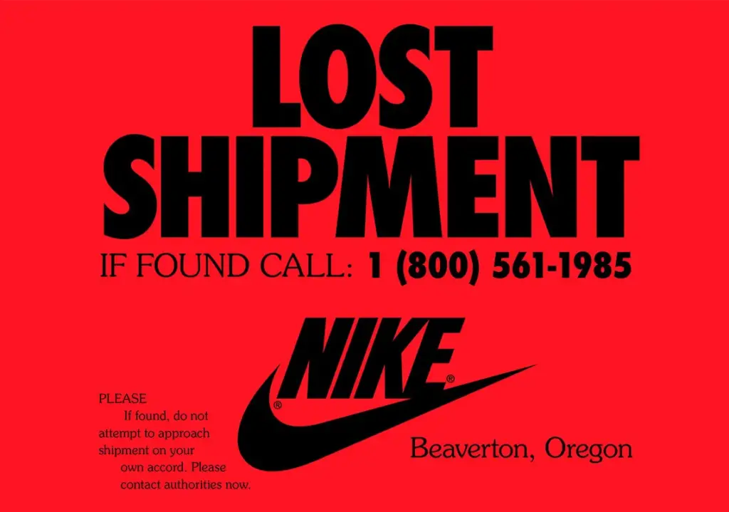An advertisement with bright red background in bold black text from Nike that says: 
'LOST SHIPMENT
IF FOUND CALL: 1 (800) 561-1985
PLEASE
If found, do not attempt to approach shipment on your own accord. Please contact authorities now.'
At the bottom it has the Nike swoosh logo, and the words 'Beaverton, Oregon'